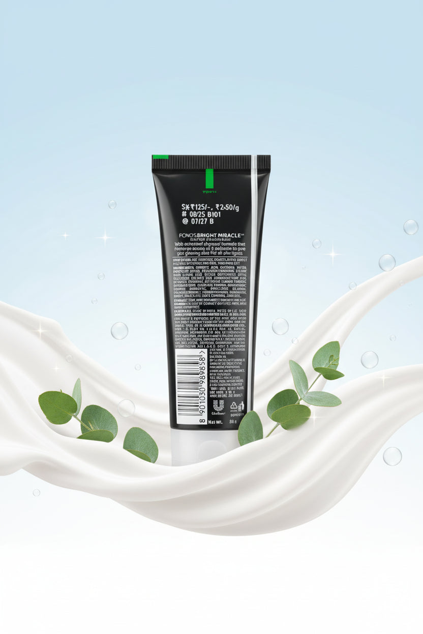 Hand holding a tube of black hair product with visible text and branding.